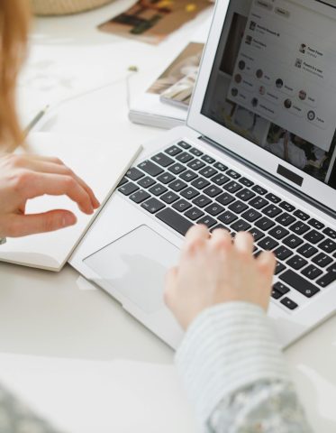 pexels-photo-9907957-9907957 A person working remotely on a laptop in a modern, creative home office environment.